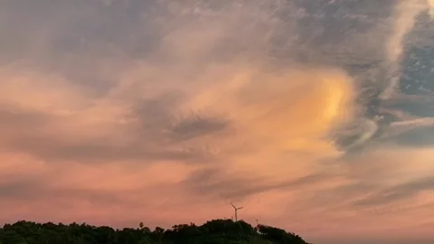 Big white windmill on top of the mountain when sunset Stock Footage 137998937