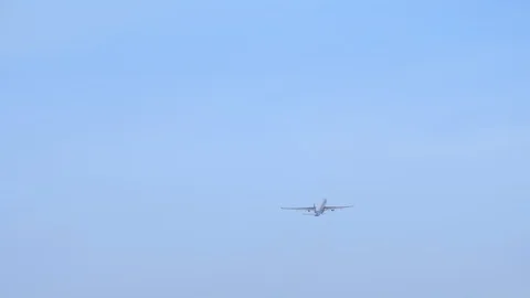 Big wide-body jet engine airplane is taking off in the clear blue sky Video stock 114560956