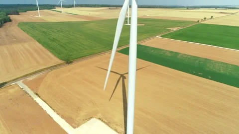 Big Wind Turbine Casting Shadow on Wind Farm, Rising Shot - Haute Marne, France  Stock Footage 259847859