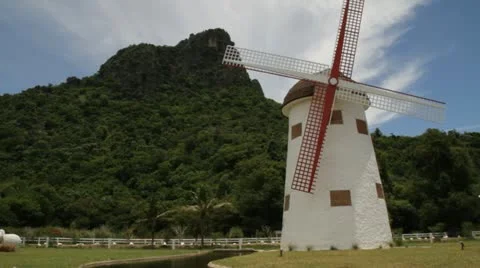 Big windmill in farm hill background Stock Footage 11830625