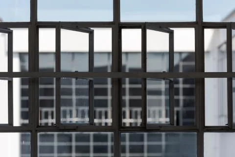 Big window front with partially opened windows of the Bauhaus in Dessau on cl Stock Photos