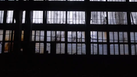Big windows from inside of an old and abandoned warehouse Stock Footage 87614781