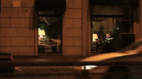 Big Windows of a restaurant in the evening Stock Footage 50235379