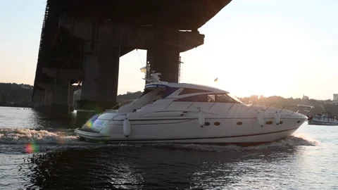 Big yacht floating under the bridge on the river Stock Footage 159678089
