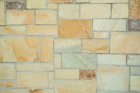 Big yellow bricks in the wall background Stock Photos