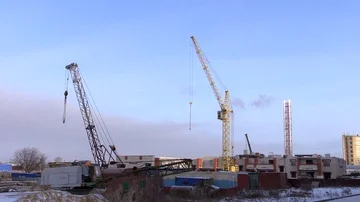 Big yellow construction crane in winter Stock Footage 85793304