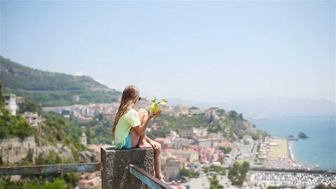 Big yellow lemon in hand in background of mediterranean sea and sky. Stock Footage 111932560