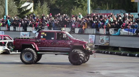 Bigfoot pulling another monster truck, sporting event, show Stock Footage 46752945
