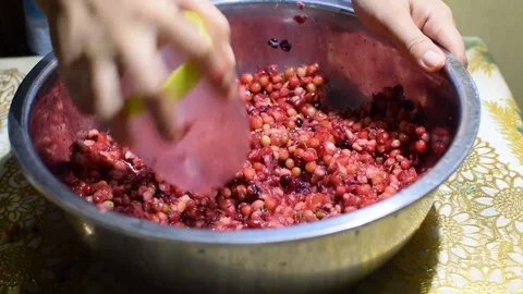 Bignay, home wine processing thorough crushing of fruit with drinking glass Stock Footage 91185151