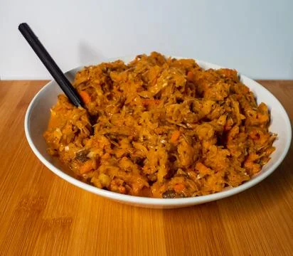 Bigos cabbage, a typical dish of eastern cuisine, eaten on white plates and a Stock Photos