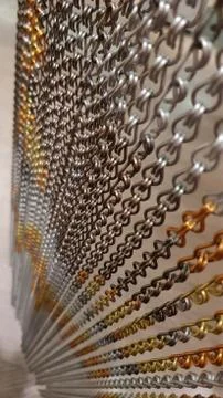 Bijou chains texture closeup with copy space on blurry background Foto stock