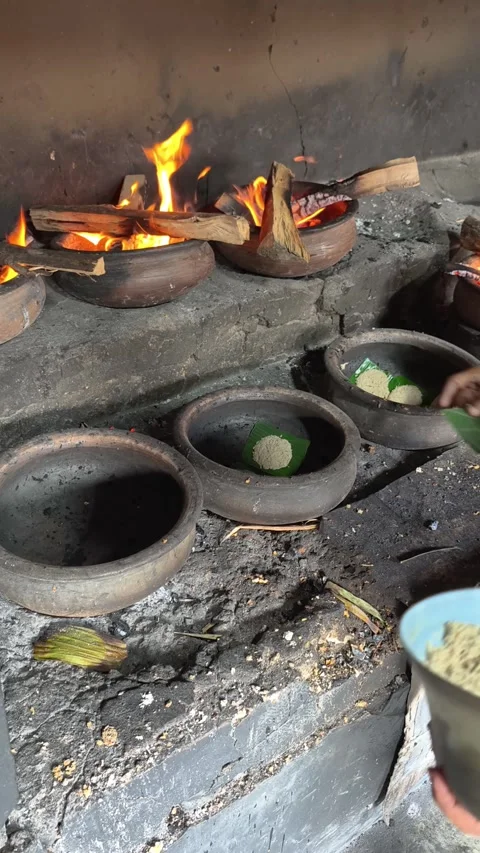 Bika Baker Pouring Batter into Clay Molds Before Traditional Wood-Fired Baking Stock Footage 339793353