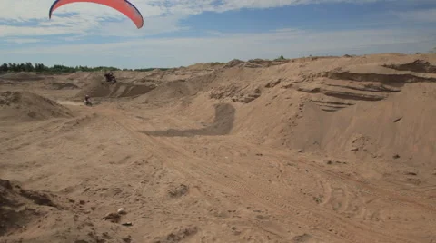 The bike competes with the glider Stock Footage 49639208