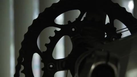 Bike Gear Silhouette Against Drawn Window Blinds Stock Footage