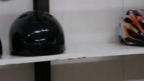 Bike Helmets on a shelf Stock Footage 250193409