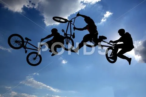 Bike jump silhouettes multiple exposure Stock Photos