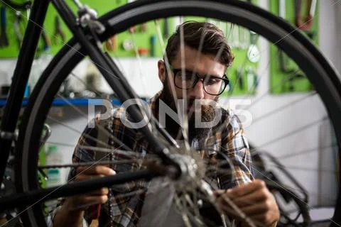 Bike Mechanic Checking At Bicycle