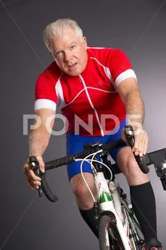 Bike owner pedals bicycle mounted maintain adjust gearbox gear shifter Stock Photos