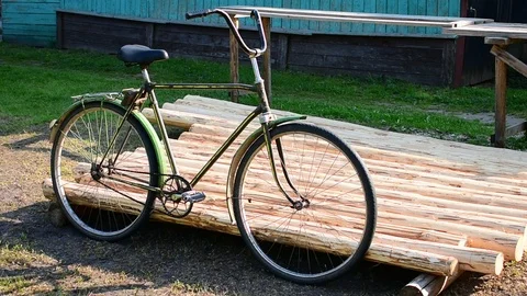 The bike is parked by the logs Stock Footage 110837852