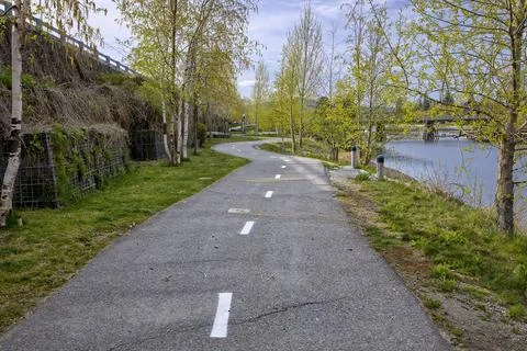 Bike path by the river. Stock Photos