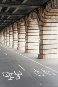 Bike path under Bercy bridge in Paris Stock Photos