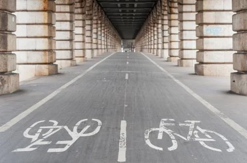 Bike path under Bercy bridge in Paris Stock Photos