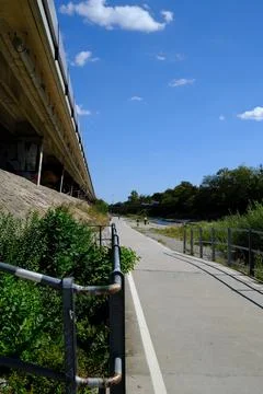 Bike path under the bridge. Stock Photos