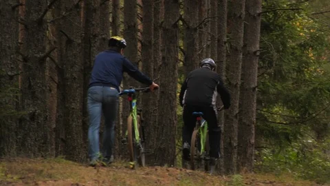 Bike ride through the woods Stock Footage
