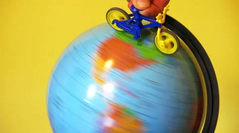 Bike rides on the globe. Stock Footage 67208080