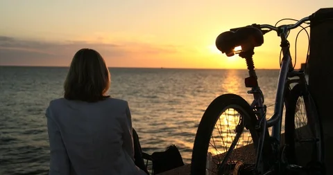Bike sunset seafront Stock Footage 87182702