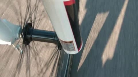 Bike Tire Spokes Spinning on Road Stock Footage