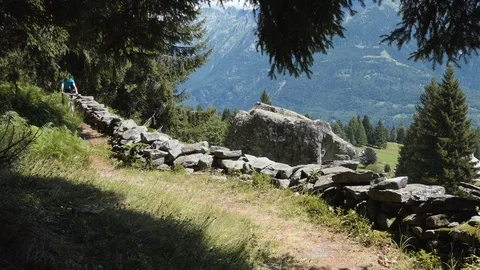 Biker on alpine trail with rocks Stock-Footage 114175501