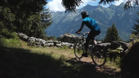 Biker on alpine trail with rocks Stock-Footage 114175558