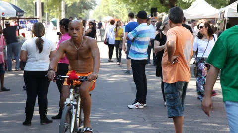 Biker and crowd at Porto Alegre's Flea Market (FleaMkt 45) Video stock 23756037