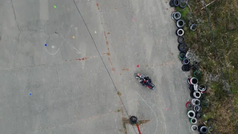 Biker on the asphalt doing exercises Stock Footage 302030463