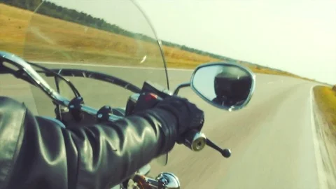 Biker on the autumn road tripping Stock Footage 80909422
