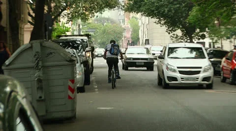 Biker with backpack rides against traffic (PoAbikes18) Vídeos de archivo 23730847