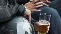 Biker in black leather jacket holding beer, talking with another motorcyclist HD Footage
