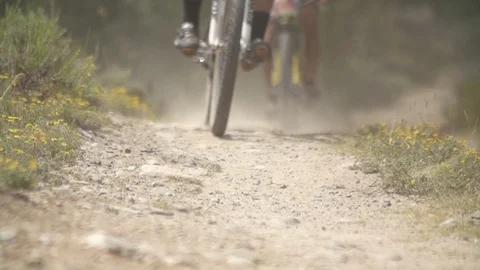 Biker Coasting Down Trail In Slow Motion 스톡 동영상 105885201
