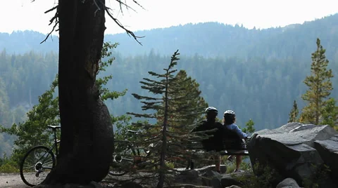 BIKER COUPLE IN MOUNTAINS Stock Footage 28837108