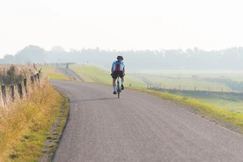 Biker on a dike Stock Photos