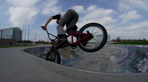 Biker does Front Peg Stall in Bowl Stock Footage 43097778