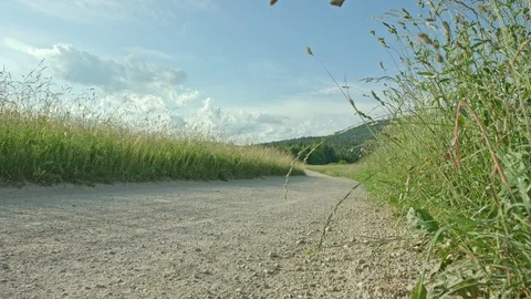 A biker doing an epic skid on a road in the fields Stock Footage 107568895