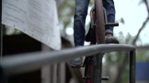 Biker doing peg grind down the hand rail over the stairs Slow Motion 400 fps Stock Footage 56965837