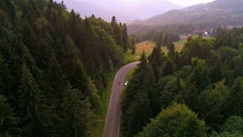Biker drives motorcycle chopper on empty mountain road road in the morning. Stock-Footage 150617214