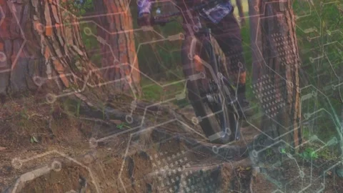 Biker entering gap, navigating roots, grate, shifting weight to control, tech Stock Footage 333602753