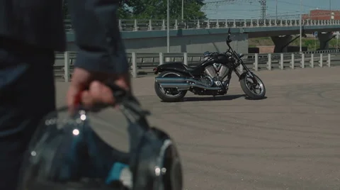 Biker gets on a motorcycle Stock Footage 63459327