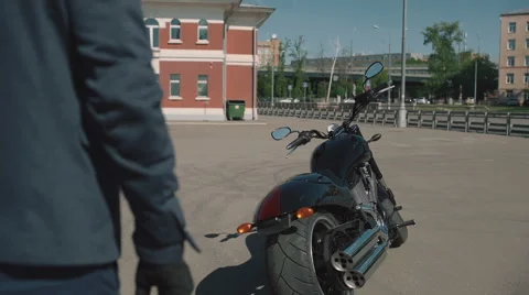 Biker gets on a motorcycle Stock Footage 63460568
