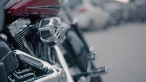 Biker getting ready to drive Harley-Davidson motorbike in slow motion Stock Footage 89979113