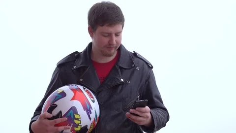 Biker with a helmet uses a smartphone. Technology and internet concept Stock Footage 73688099